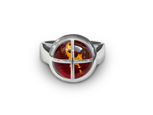 Ruby with gold ashes in glass ring with cross